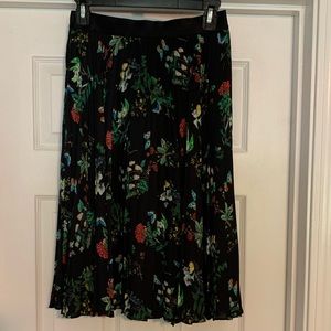 Floral/butterfly pleated skirt.